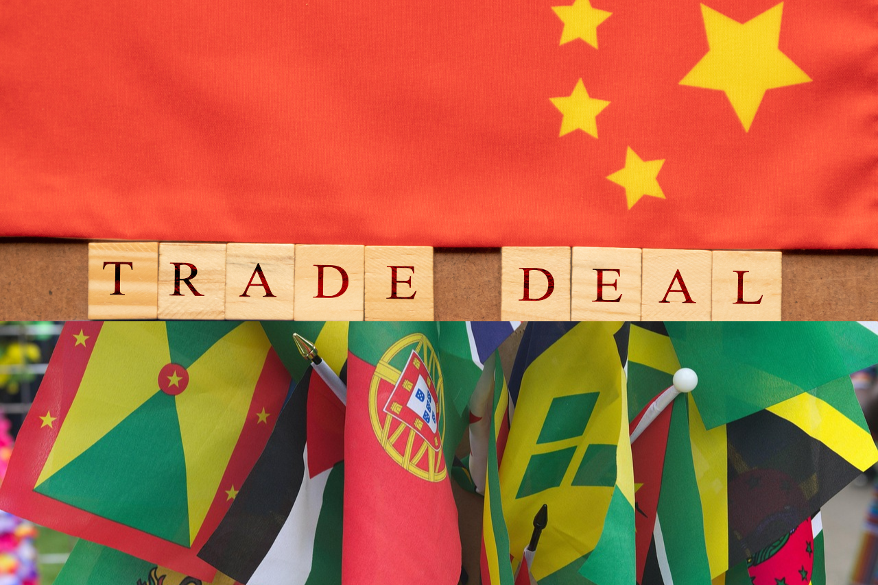 Chinese and Caribbean flags with the words trade deal in the middle.