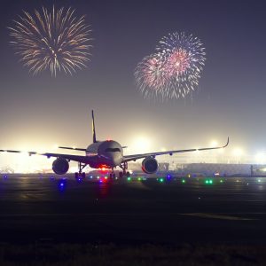 Plane arriving with celebratory fireworks.